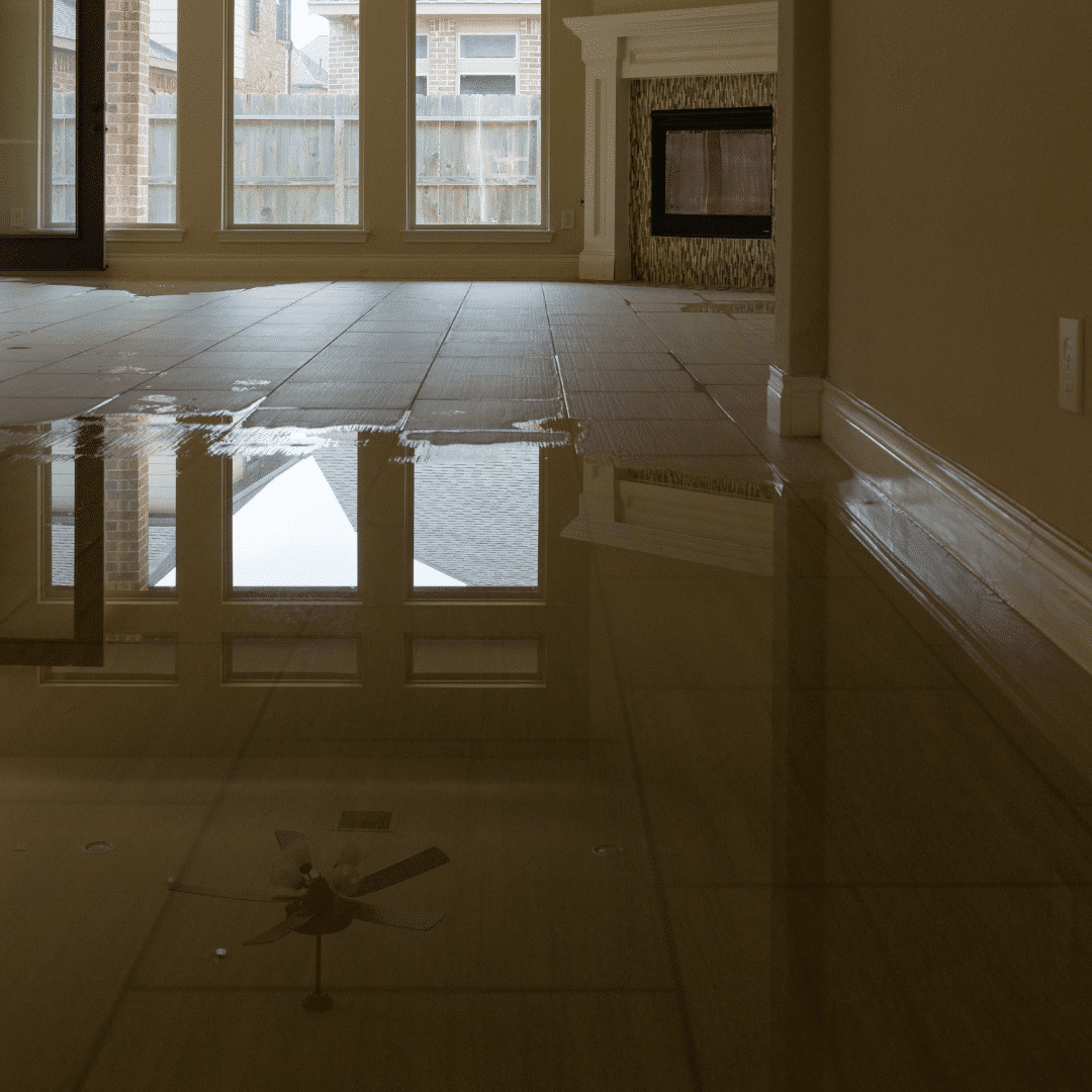 A flooded living room tile floor