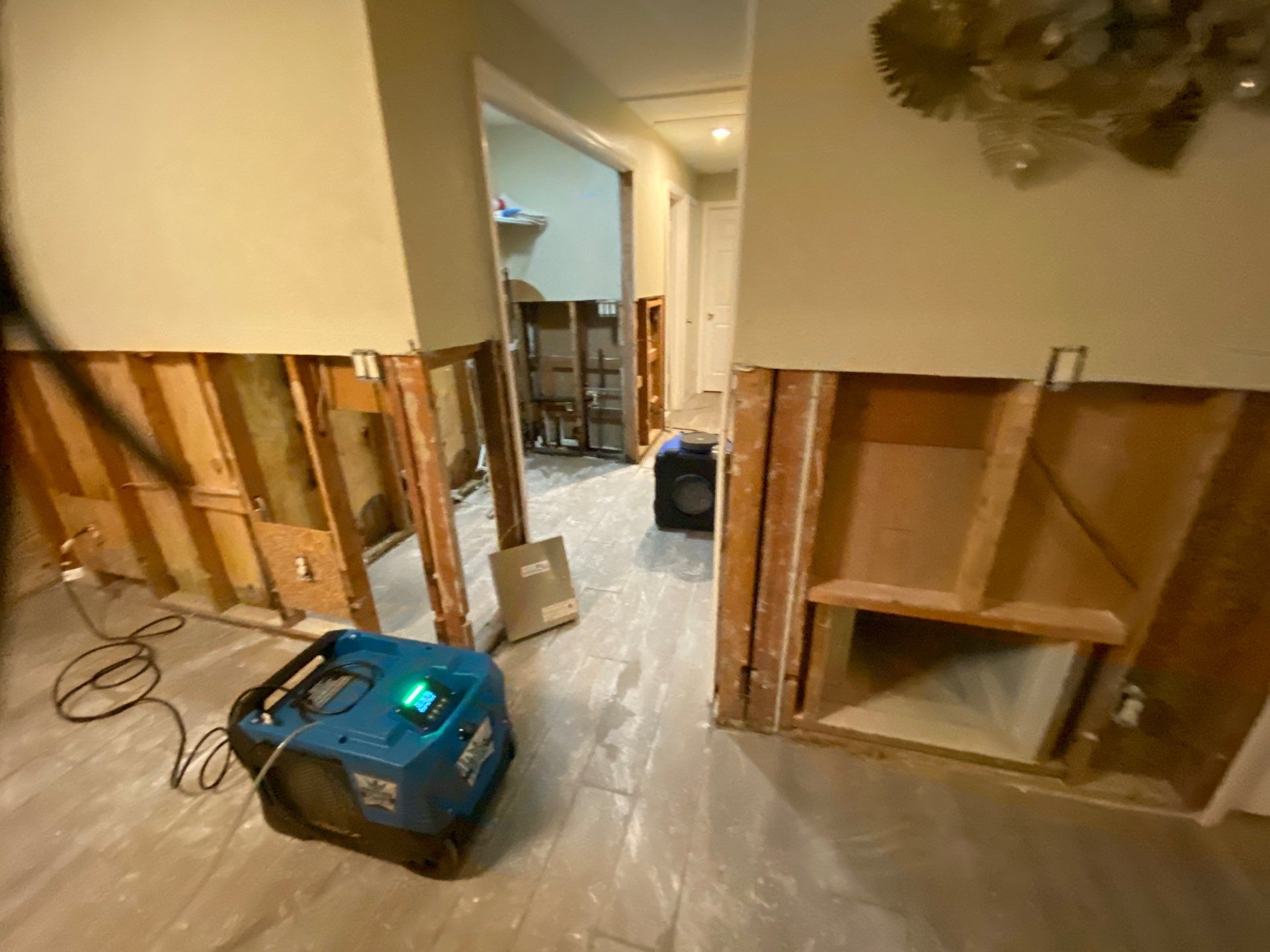 Flooded living room with drying equipment
