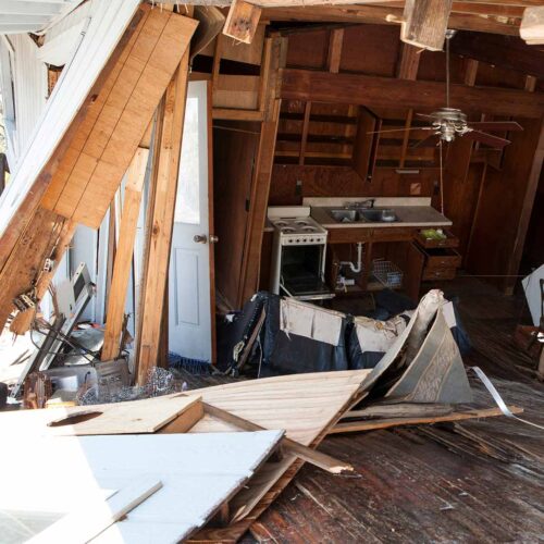 Attic interior with storm damage debris