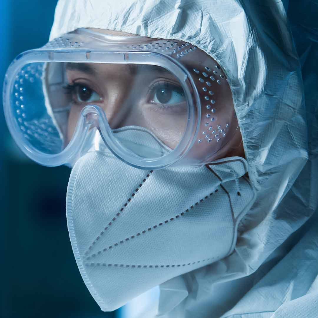 Worker wearing protective mask and goggles