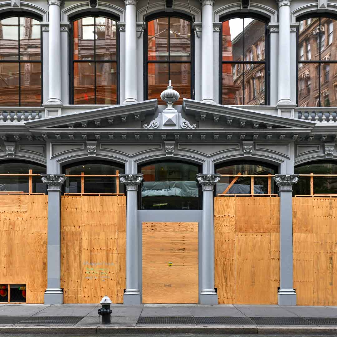Boarded-up storefront windows